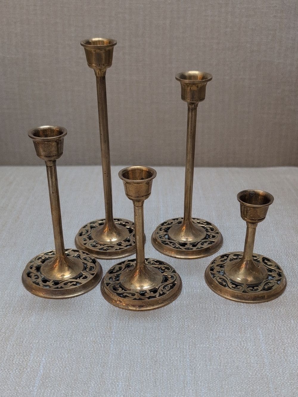 Vintage Graduated Brass Candle Holders Ornate Carved Openwork Bases Set of 5
